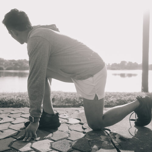 Athlete runner feet running on road, Jogging concept at outdoors Athlete runner feet running on road, Jogging concept at outdoors